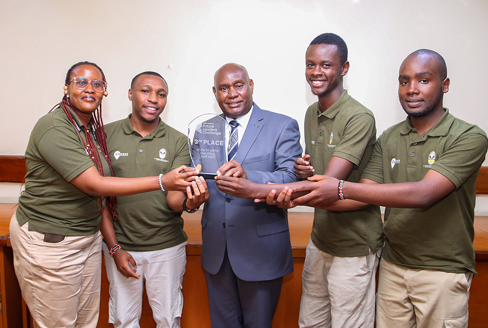 Tourism Tech’ Project developers present the trophy they won during East Africa Future Leaders Challenge to the VC Prof. Benedict Mutua Tourism Tech’ Project developers present the trophy they won during East Africa Future Leaders Challenge to the VC Prof. Benedict Mutua