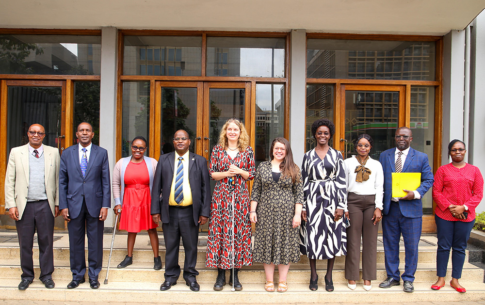 A delegation from Tangaza University led by DVC –ARS Dr. Daniel Kitonga (4th L) and team from Royal Holloway University of London in a group picture with DVC-IAE Prof. Paul Wambua (2nd L) and members of the working group from TU-K